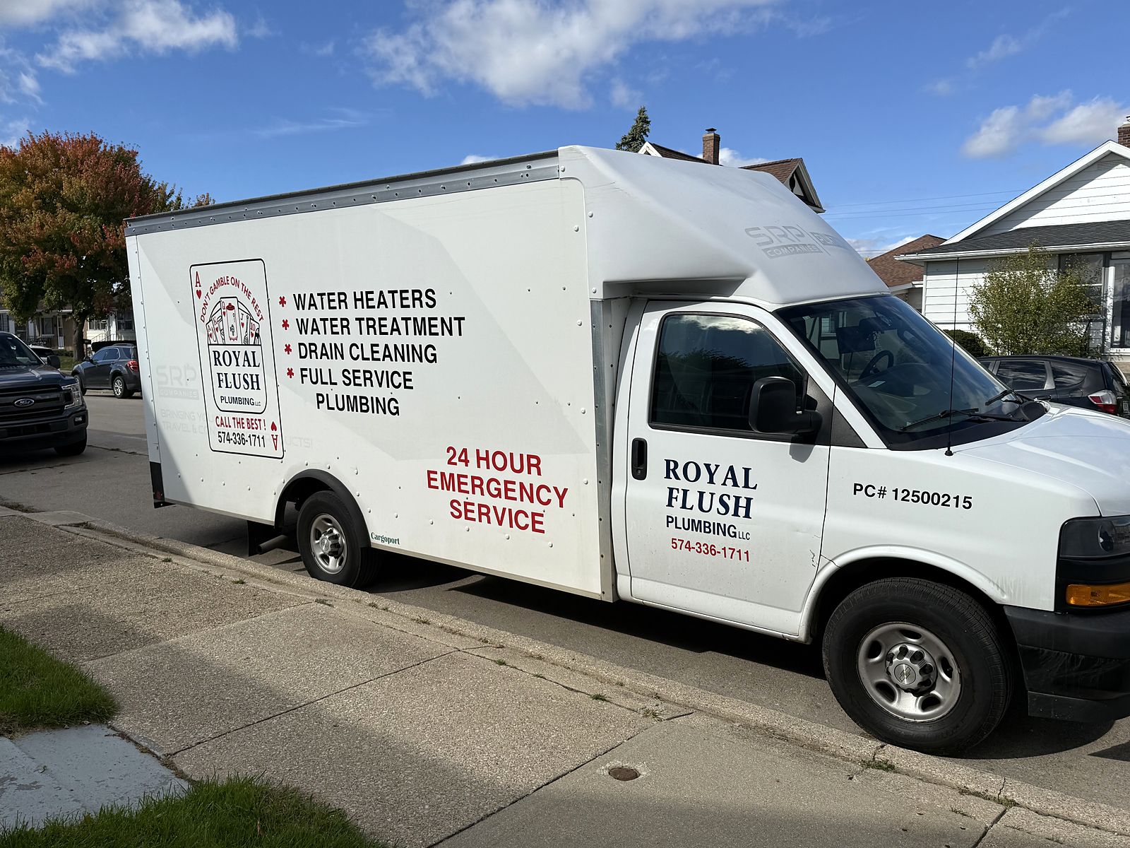 Royal Flush Plumbing service truck parked on a residential street