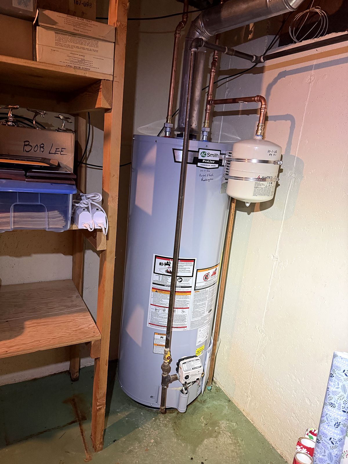 Tank water heater with expansion tank installed in a basement